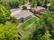 Aerial view showcasing the home's generous lot, expansive backyard, and inviting covered deck at 1420 W Ridge Rd, Littleton, CO 80120