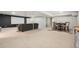 Spacious finished basement with a large seating area, bar, and entertainment space at 1420 W Ridge Rd, Littleton, CO 80120