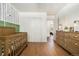 Bedroom featuring wood floors, a modern accent wall, window, closet, and dresser at 1420 W Ridge Rd, Littleton, CO 80120