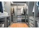 Custom closet featuring modern shelving and drawers, providing ample storage space for an organized wardrobe at 1420 W Ridge Rd, Littleton, CO 80120