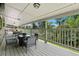 Covered deck with outdoor furniture, perfect for relaxing or entertaining at 1420 W Ridge Rd, Littleton, CO 80120