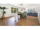 Bright dining room with view to outside, stylish decor, and hardwood floors at 1420 W Ridge Rd, Littleton, CO 80120