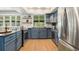 Bright kitchen boasts stainless steel appliances, ample cabinetry, and lots of light at 1420 W Ridge Rd, Littleton, CO 80120