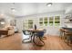 Open concept living room with eat-in kitchen and access to the backyard at 1420 W Ridge Rd, Littleton, CO 80120