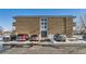 Brick building exterior with ample parking at 1608 Cottonwood Dr # 4, Louisville, CO 80027