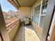 Balcony featuring a grill for outdoor cooking and dining, and an exterior view at 11983 W Long Cir # 203, Littleton, CO 80127