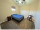 Bedroom featuring carpet, ceiling fan, and natural light from the window at 11983 W Long Cir # 203, Littleton, CO 80127
