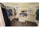 Walk-in closet showcasing organized shelving and hanging storage for optimal organization at 11983 W Long Cir # 203, Littleton, CO 80127