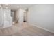 Upstairs hallway with neutral carpet, white walls, and access to bedrooms at 1448 Orchard St, Brighton, CO 80601