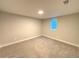 Bright carpeted bedroom with a window and neutral paint at 6484 S Datura St, Littleton, CO 80120