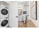 Bathroom with laundry room access featuring a white single sink vanity at 5367 W 14Th Ave, Lakewood, CO 80214