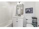White bathroom features stylish fixtures and a shower and bathtub combination at 5367 W 14Th Ave, Lakewood, CO 80214