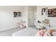 Bright bedroom features gray carpet, playful wall art, makeup vanity and pink decorative elements at 5367 W 14Th Ave, Lakewood, CO 80214