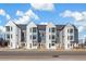 Modern townhome exterior showcasing contemporary design, clean lines, and street view at 5367 W 14Th Ave, Lakewood, CO 80214