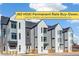 Modern townhomes featuring unique siding and large windows, offering stylish urban living with no HOA and rate buy-down at 5367 W 14Th Ave, Lakewood, CO 80214