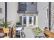 Modern townhome exterior with well-manicured landscaping and welcoming front entrance with seating at 5367 W 14Th Ave, Lakewood, CO 80214