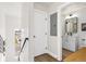 Hallway with view of a bathroom with a white single sink vanity at 5367 W 14Th Ave, Lakewood, CO 80214