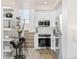 Contemporary kitchen with white cabinets, stainless appliances, and a breakfast nook near the stairs at 5367 W 14Th Ave, Lakewood, CO 80214