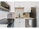 Modern kitchen with white countertops, stainless steel appliances, and white cabinets at 5367 W 14Th Ave, Lakewood, CO 80214