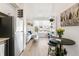 Open-concept blends kitchen, dining, and living, creating seamless flow, enhanced by natural light, modern design, and stylish decor at 5367 W 14Th Ave, Lakewood, CO 80214