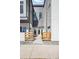 Close up view of modern townhome exteriors with a shared sidewalk and entrance at 5367 W 14Th Ave, Lakewood, CO 80214