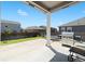 Covered backyard patio area that includes a stainless steel grill for outdoor entertaining and relaxing at 13644 Ulster St, Thornton, CO 80602
