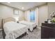 Bedroom with twin beds, soft carpet, curtains and soft natural light at 13644 Ulster St, Thornton, CO 80602