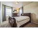 Neutral bedroom featuring plush carpet, curtains, and a wooden dresser at 13644 Ulster St, Thornton, CO 80602