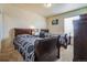Bedroom with twin beds, soft carpet, desk area, and good natural light at 13644 Ulster St, Thornton, CO 80602