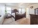This main bedroom boasts a neutral color palette, a sitting area, and an en suite bath at 13644 Ulster St, Thornton, CO 80602