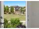 View of community park through the front door that highlights the playground and green space for recreation at 13644 Ulster St, Thornton, CO 80602