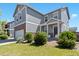 Charming two-story home with a well-manicured lawn and a welcoming front porch at 13644 Ulster St, Thornton, CO 80602