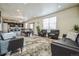 Spacious living area that flows seamlessly into the kitchen and dining area at 13644 Ulster St, Thornton, CO 80602