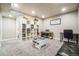 Spacious playroom features built-in shelves, a piano, and a ' activity table for creative fun at 13644 Ulster St, Thornton, CO 80602