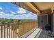 A beautiful condo balcony offers panoramic views of city skyline and green landscape at 8060 E Girard Ave # 712, Denver, CO 80231