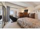 Comfortable bedroom with balcony access and furniture at 8060 E Girard Ave # 712, Denver, CO 80231