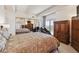 Comfortable bedroom with balcony access and mirrored closet at 8060 E Girard Ave # 712, Denver, CO 80231
