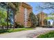Attractive brick condominium building with landscaped grounds and mature trees at 8060 E Girard Ave # 712, Denver, CO 80231