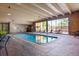 Enjoy the indoor pool, surrounded by lounge chairs and large windows for year-round swimming at 8060 E Girard Ave # 712, Denver, CO 80231