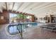 Bright indoor pool with lounge chairs and large windows provides a relaxing aquatic experience at 8060 E Girard Ave # 712, Denver, CO 80231