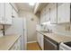 Efficient kitchen with ample white cabinetry and wood floor at 8060 E Girard Ave # 712, Denver, CO 80231