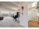 Inviting living room with piano, balcony access, and view at 8060 E Girard Ave # 712, Denver, CO 80231