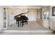 Inviting living room featuring a piano, chandelier, and neutral carpet at 8060 E Girard Ave # 712, Denver, CO 80231