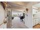 Inviting living room with piano, balcony access, and view at 8060 E Girard Ave # 712, Denver, CO 80231