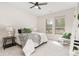 Bright bedroom with a queen-size bed and large windows at 13456 Via Varra # 118, Broomfield, CO 80020