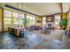Spacious community room with seating, fireplace, and kitchenette at 13456 Via Varra # 118, Broomfield, CO 80020