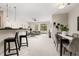 Bright dining area with a modern table and four gray chairs at 13456 Via Varra # 118, Broomfield, CO 80020