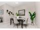 Elegant dining room featuring a dark wood table and gray chairs at 13456 Via Varra # 118, Broomfield, CO 80020