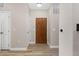 Light and airy entryway with wood flooring and neutral tones at 13456 Via Varra # 118, Broomfield, CO 80020