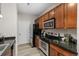 Kitchen features stainless steel appliances and wood cabinets at 13456 Via Varra # 118, Broomfield, CO 80020